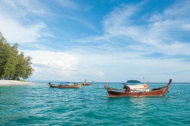 istock Boat on the beach at sunrise time 505746666