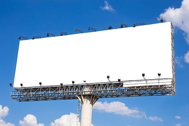 istock Blank billboard ready for new advertisement with blue sky background 505749300