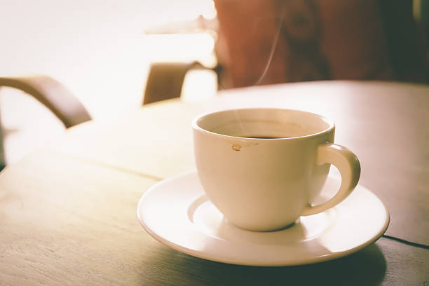 istock Cup of coffee on wooden table 505750580