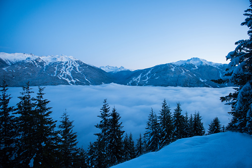 Dual Mountain views of Whistler and Blackcomb Mountains with valley fog