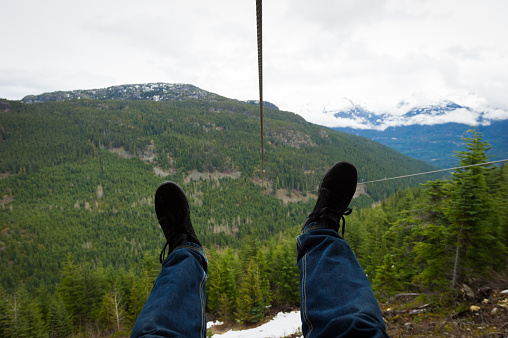 Riding a zipline ride in the mountains
