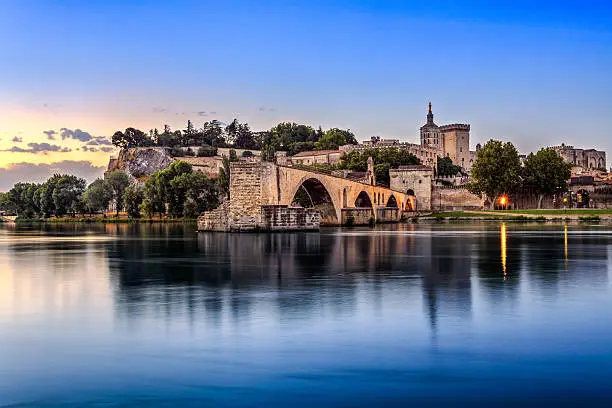 Avignon Bridge with Popes Palace and Rhone river at sunrise, Pont Saint-Benezet, Provence, France