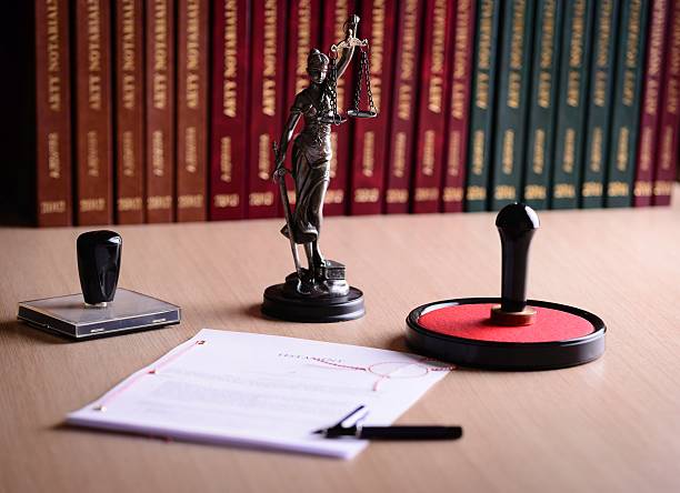 document waiting for a notary public sign on desk - steno stok fotoğraflar ve resimler