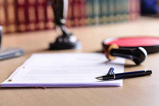 Contract waiting for a notary public sign on desk. Contract waiting for a notary public sign on desk. Notary public accessories legal document stock pictures, royalty-free photos & images