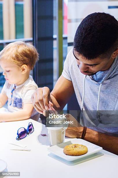 Relationship Between Father And Son Stock Photo - Download Image Now - Adult, African Ethnicity, Afro Hairstyle