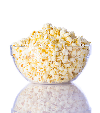 Glass Bowl of Popcorn isolated on white background