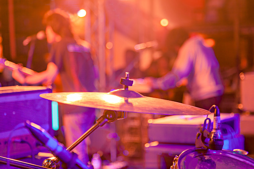Band playing at a live concert, shallow depth of field
