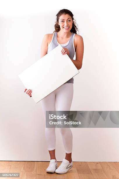 Young Woman With Blank Sign Stock Photo - Download Image Now - Females, University Student, White Background