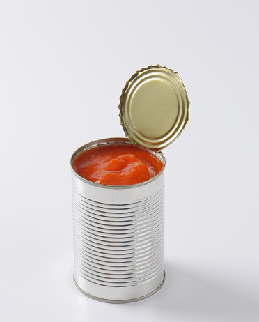can of peeled tomatoes on white background