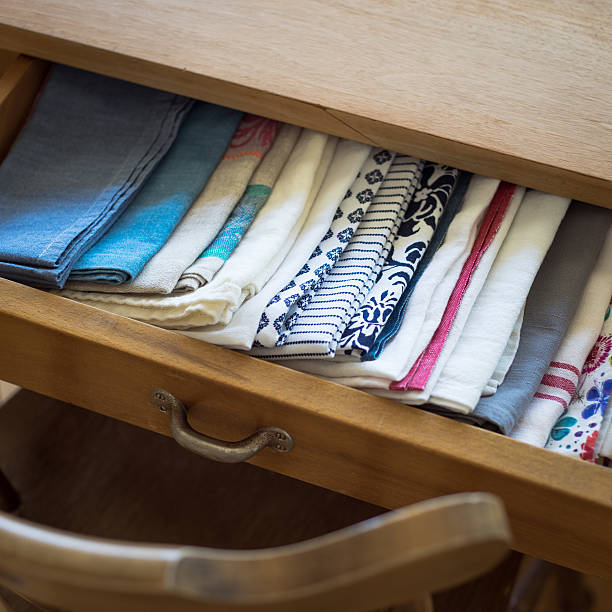 istock Tea towels arranged in a drawer of dining table 505771036