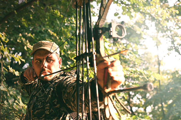 Profile of bowman with bow and arrow.