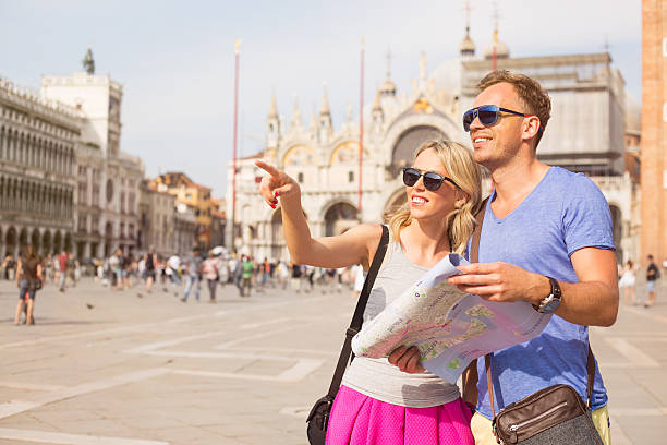 istock Tourists in Venice looking for directions 505771652