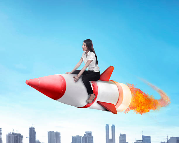 istock Asian business woman flying ride rocket 505773688