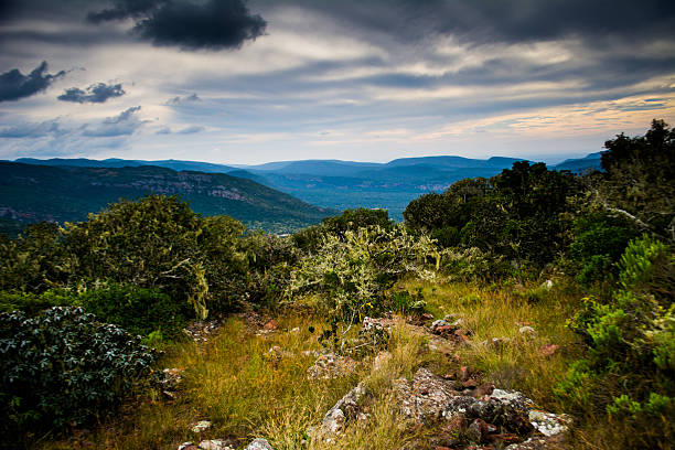 Green mountain landscape with dark clouds
