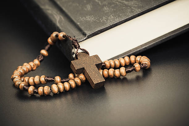 istock Christian cross necklace on Holy Bible book 505774154