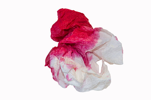 Paper handkerchief with blood stains. stock photo