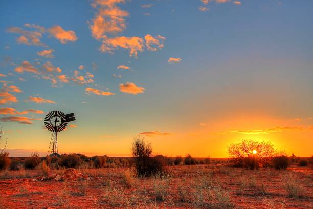 Windmill in remote Australian outback Lonely windmill in the evening time somewhere in remote Australia. outback photos stock pictures, royalty-free photos & images