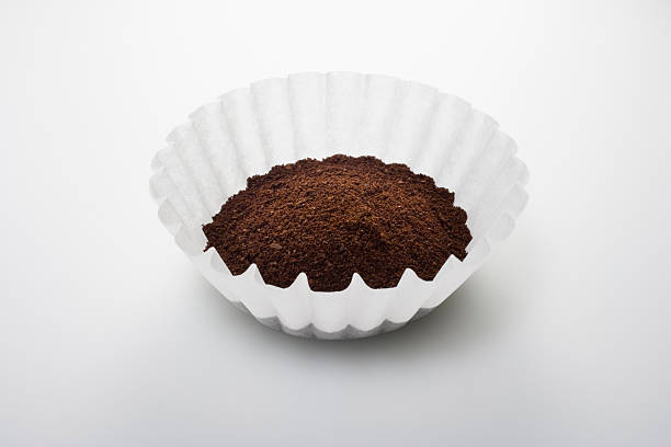 Ground coffee in filter Ground coffee in filter coffee filter stock pictures, royalty-free photos & images