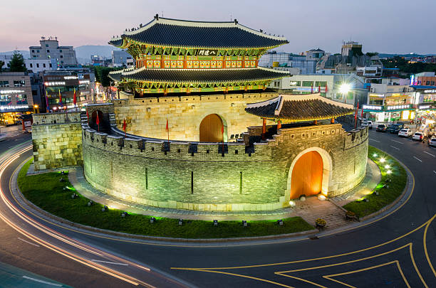 istock Late night traffic blurs past Paldalmun Gate in Suwon 505777608