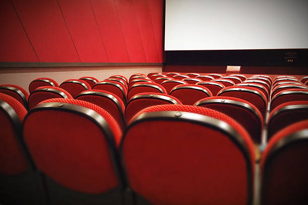 istock Empty movie theater with red seats 505778214