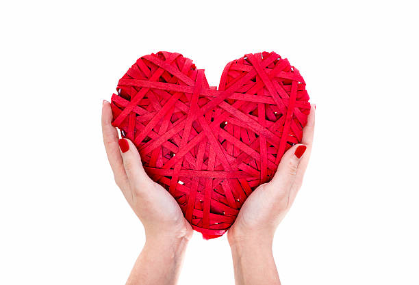 istock Red Wicker Heart In Woman Hands 505778460