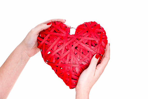 istock Red Wicker Heart In Woman Hands 505778520