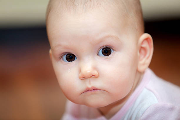 istock Close-up of a small child who cries but does 505779318