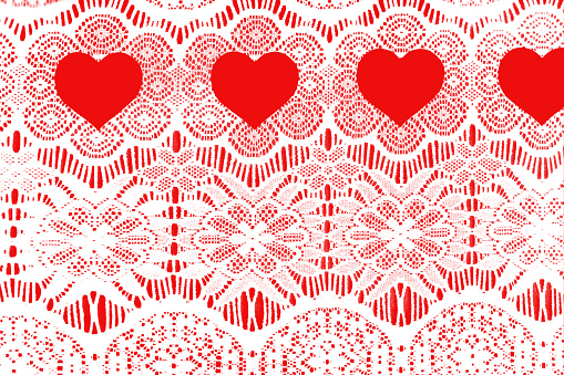 Cream colored lace lies on top of red background.  Red hearts in a row at top.  Perfect for Valentine's Day themes.  Love, romance, femininity.  No people. 