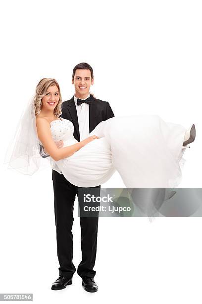 Young Groom Carrying A Bride In His Hands Stock Photo - Download Image Now - Wedding, Couple - Relationship, Carrying