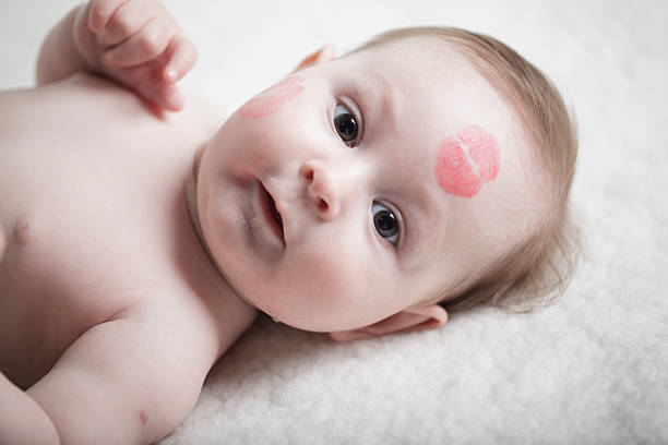 istock baby with kiss on the face 505781712