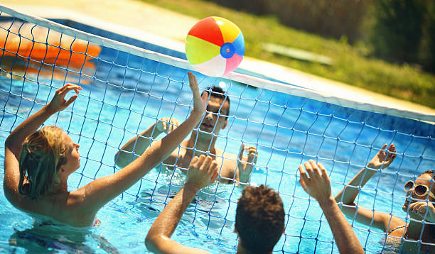 istock Friends playing volleybay in a pool. 505781790