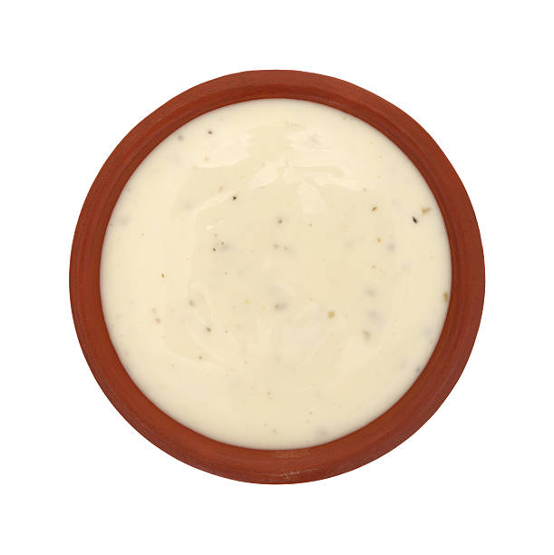 Bowl of ranch dressing on a white background top view Top view of a small bowl of ranch dressing isolated on a white background. ranch dressing stock pictures, royalty-free photos & images