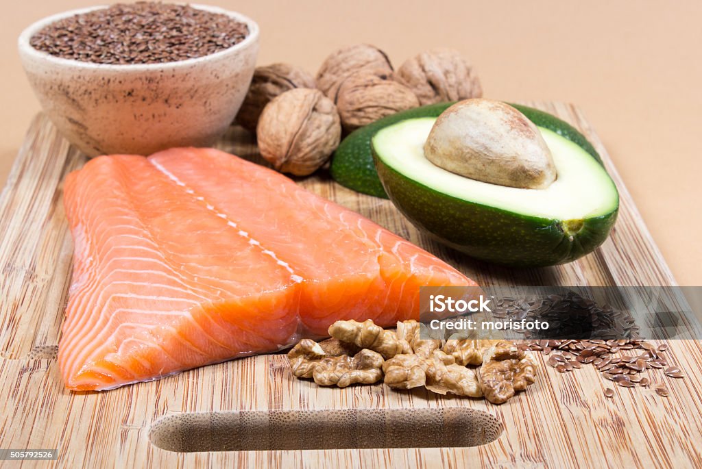 Sources of omega 3 fatty acids Sources of omega 3 fatty acids: flaxseeds, avocado, salmon and walnuts Acid Stock Photo