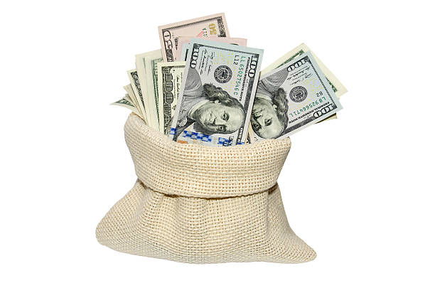 istock dollar bills in bag isolated on white background 505794186