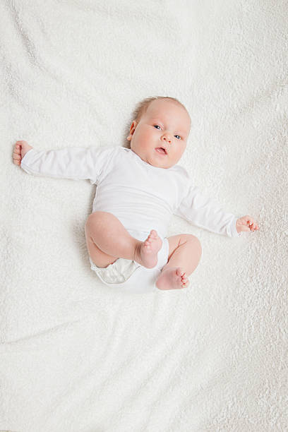 istock Newborn baby in white romper 505795286