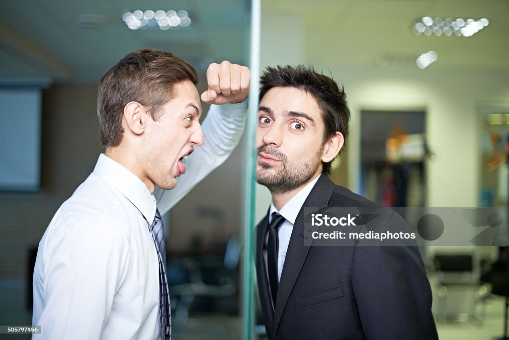 Confrontation at work Businessman screaming at his colleague behind window 30-34 Years Stock Photo