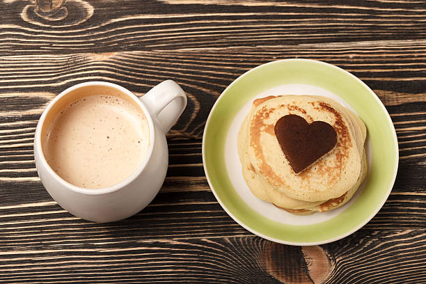 istock stack of pancakes on wooden board 505797546