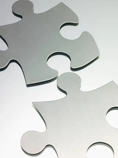 Photo of Two blank jigsaw puzzle pieces