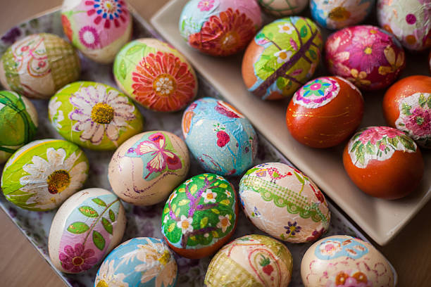 Happy Easter! Basket full of hand colored Easter Eggs in decoupage decoupage stock pictures, royalty-free photos & images