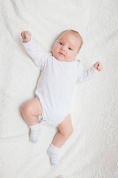 istock Newborn baby in white romper 505803014