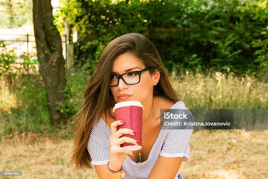 Beautiful brunette with mug in hands. Adult Stock Photo