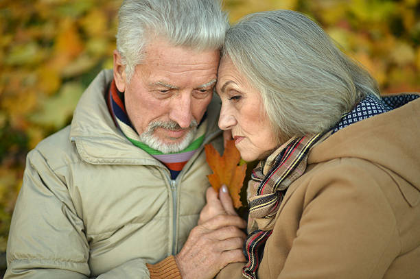 istock Sad senior couple in  park 505805970