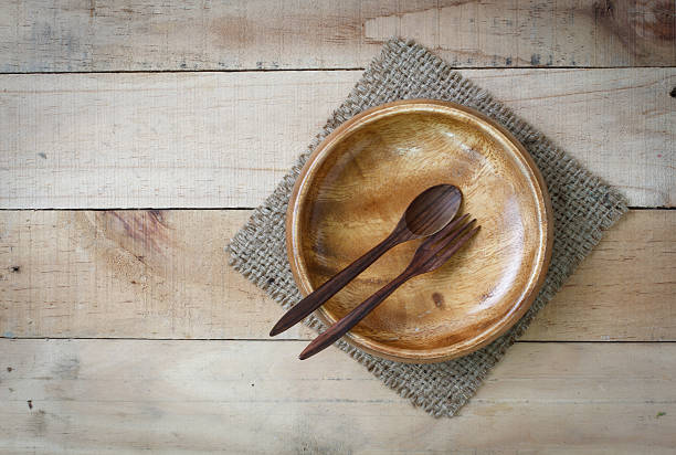 istock empty wood dish with spoon and fork on wooden 505817240
