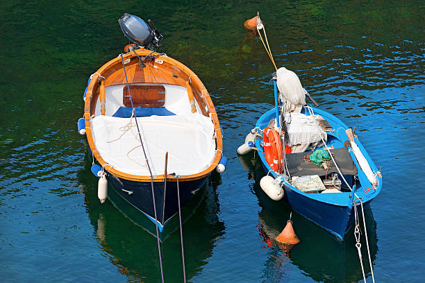 dois barcos em ligúria itália - rowboat nautical vessel small motorboat imagens e fotografias de stock