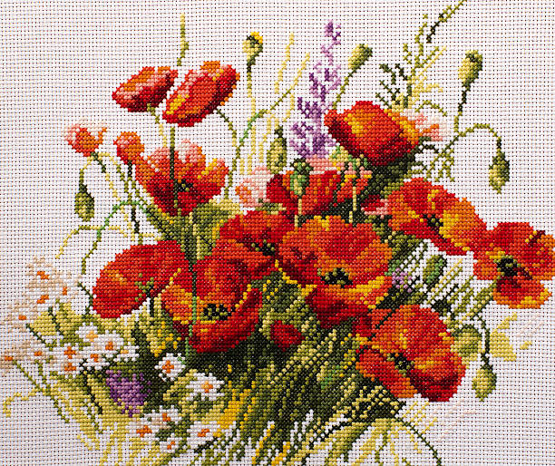 흰색 배경의 fancywork poppies - cross stitch thread textile craft 뉴스 사진 이미지