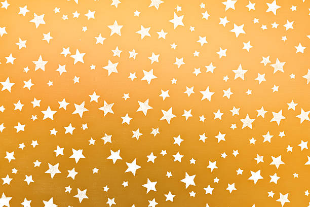 istock little white stars on golden background 505818226