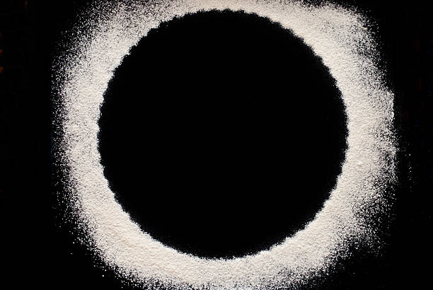 istock white flour on black background - free space for text 505820748