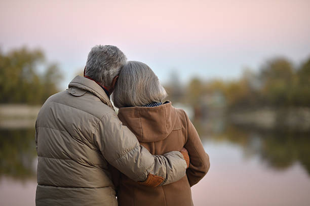 istock senior couple near river 505820880