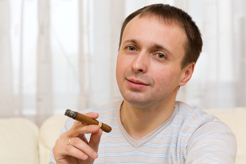Middle-aged man smoking a cigar