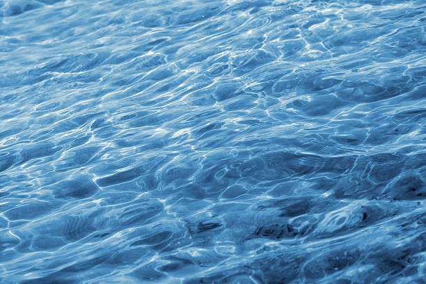 istock sun glare on the sea water. 505826756